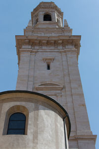 Low angle view of bell tower against sky