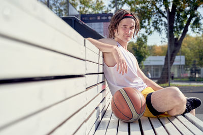 Young woman playing basketball