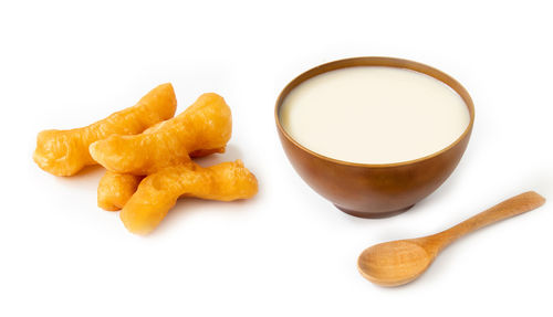 High angle view of breakfast on table against white background