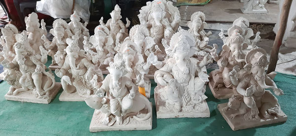 High angle view of sculptures on table at market