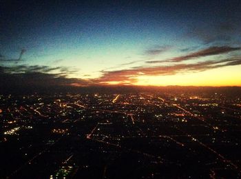 Aerial view of cityscape at sunset