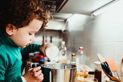 Midsection of man having food at home