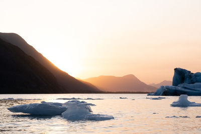 Scenic view of sea against clear sky during sunset