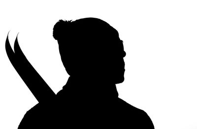 Close-up of silhouette man against white background