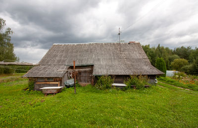 House on field against sky