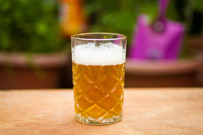 Close-up of beer glass on table