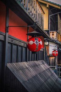 Red lantern hanging outside house