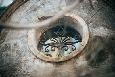 High angle view of old metal on wall