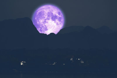 Scenic view of silhouette mountain against sky at night