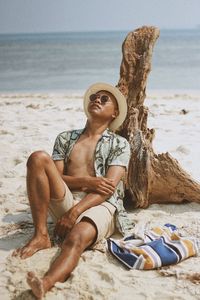 Portrait of woman sitting on beach