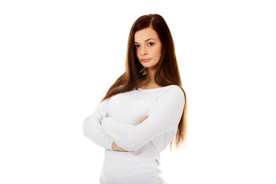 Portrait of woman standing against white background