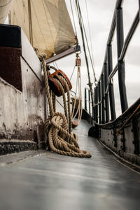 Low angle view of ropes hanging down the sail in a sailing ship
