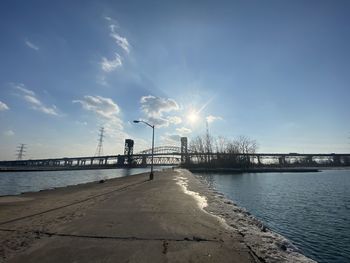 Pier over sea against sky