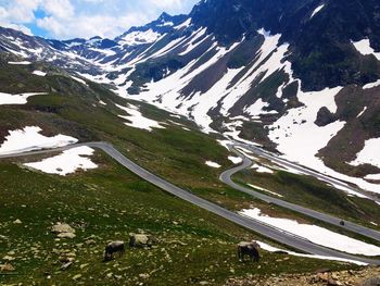 Scenic view of snowcapped mountains against sky