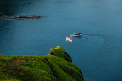 High angle view of boat sailing in sea