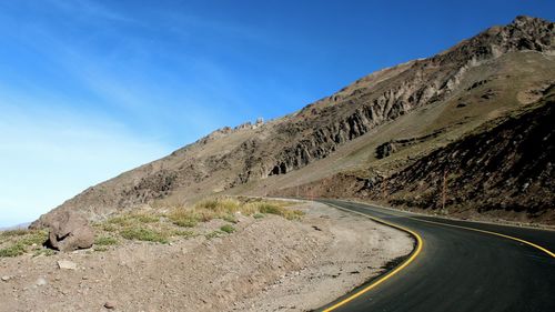 Country road leading towards mountains