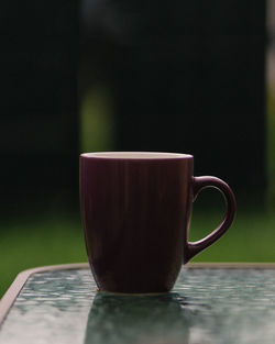 Close-up of coffee cup on table