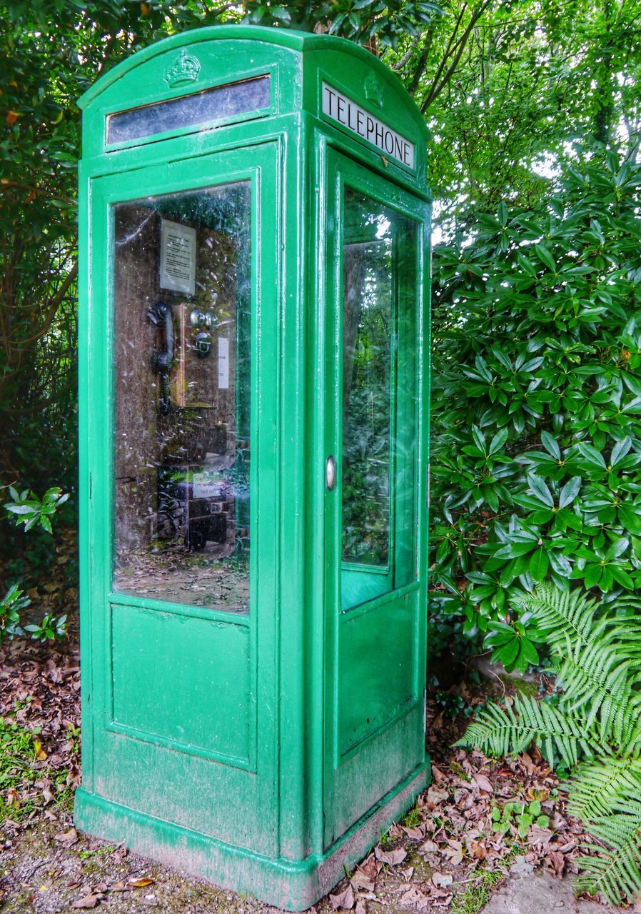 text, communication, western script, door, closed, green color, information sign, safety, built structure, entrance, building exterior, day, architecture, number, metal, non-western script, outdoors, sign, tree, capital letter