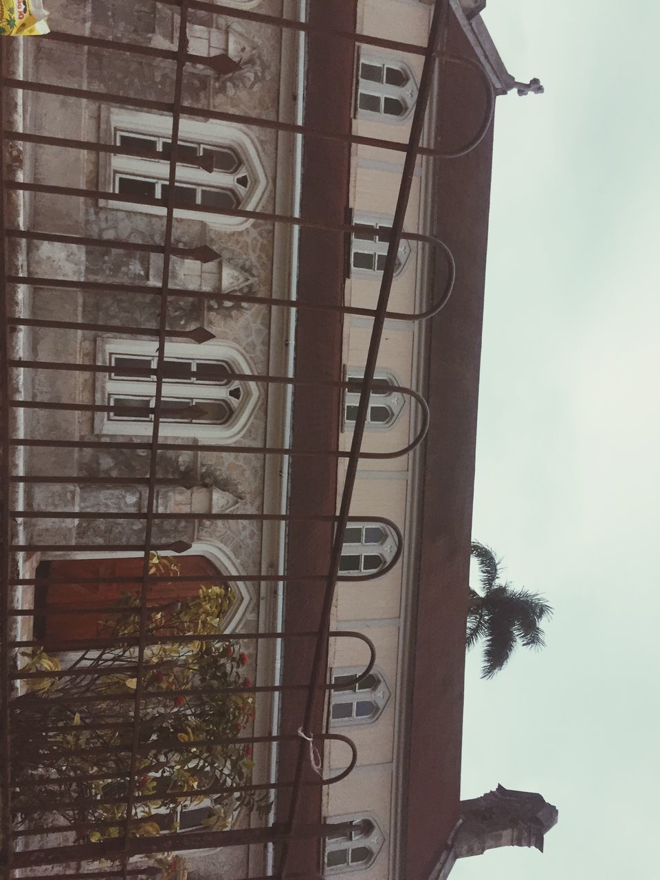 LOW ANGLE VIEW OF BUILDINGS SEEN THROUGH WINDOW