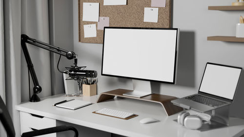 Midsection of woman using laptop on table