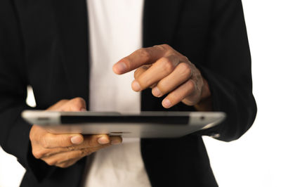 Midsection of man using mobile phone