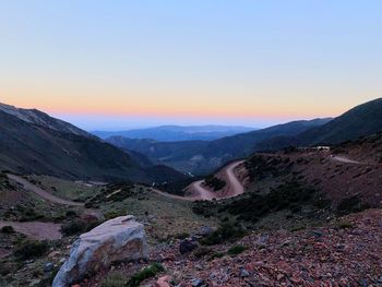 Scenic view of mountains against clear sky during sunset