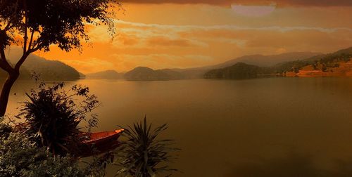 Scenic view of lake at dusk