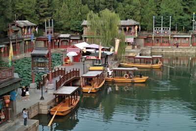 Boats moored in lake