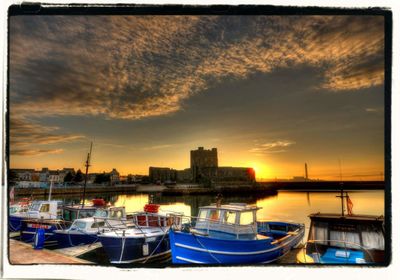 Boats moored at harbor