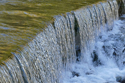 High angle view of water flowing in river