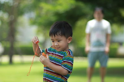 Boy standing outdoors