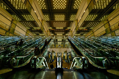 Illuminated escalators in modern building