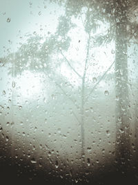 Full frame shot of wet glass window in rainy season