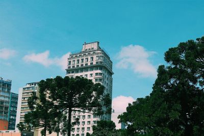 Low angle view of buildings against blue sky