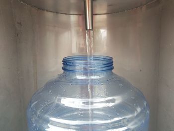 Close-up of empty glass bottle