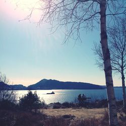 Scenic view of lake with mountains in background