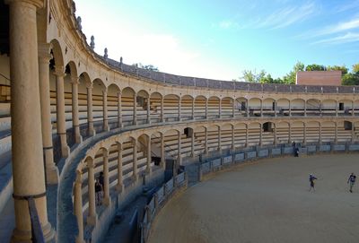 Historic amphitheatre against sky