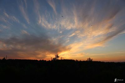 Scenic view of silhouette landscape against sky during sunset