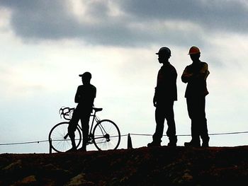 Man riding bicycle against clear sky