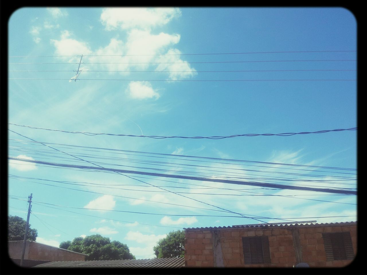 sky, power line, cable, electricity, power supply, low angle view, cloud - sky, no people, electricity pylon, outdoors, day, connection, telephone line, telephone pole, nature