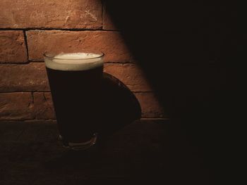 High angle view of coffee on table against wall