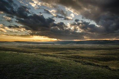 Scenic view of landscape against sky during sunset