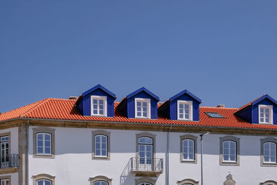 Houses against sky in city