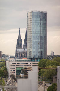 Modern buildings in city against sky