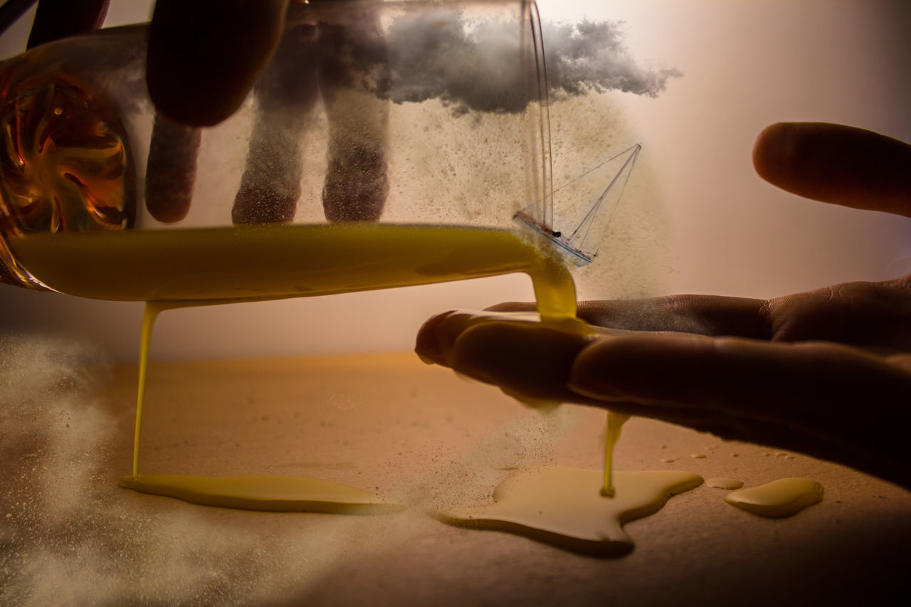 CLOSE-UP OF PERSON HAND IN PLASTIC