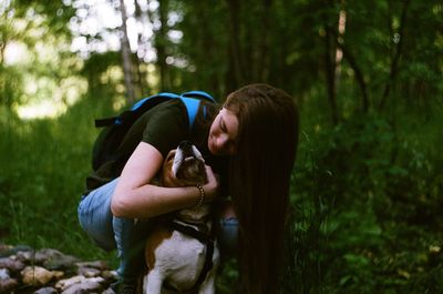 Side view of woman in forest