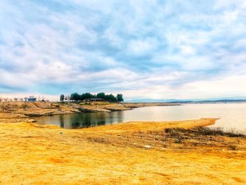 Scenic view of beach against sky