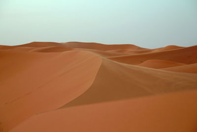 Scenic view of desert against clear sky