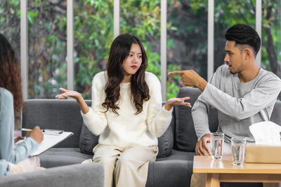 Young couple sitting on sofa