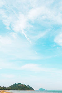 Low angle view of vapor trail over sea